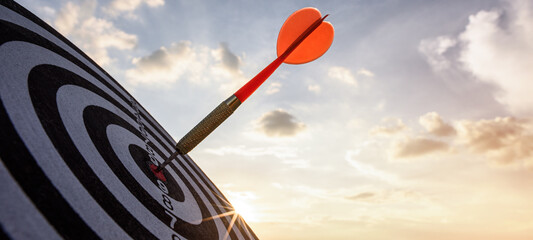 business marketing as concept. Red dart arrow hitting in the target center of dartboard Target hit...