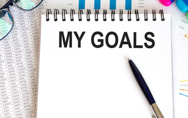 My goal is an inscription on a white notebook.