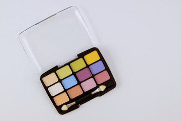 Eyeshadows palette of multicolor cosmetic make up on a isolated white background
