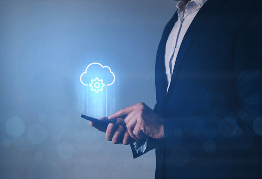 Information technologist holding phone with  cloud computing icon. Cloud computing  concept. 
