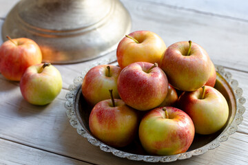 Fresh apples on the wooden background