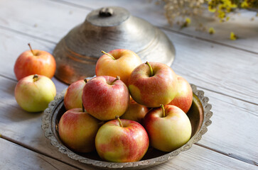 Fresh apples on the wooden background