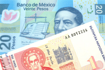 Fototapeta premium A Bulgarian one lev bank note with a blue twenty Mexican peso bank note close up in macro