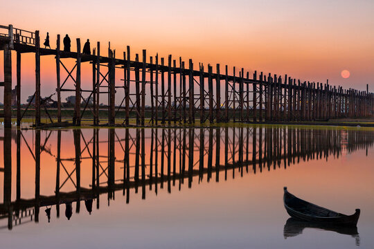 U Bein Bridge in silhouette at the sunset in Mandalay, Myanmar