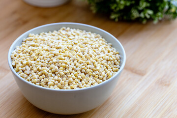Raw Dry Organic Couscous in a Bowl. Turkish Kuskus
