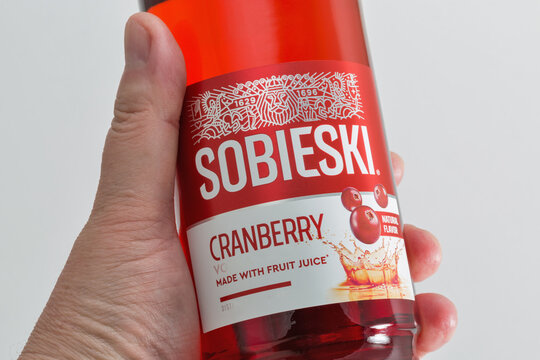 Polish Sobieski Cranberry vodka bottle closeup against white bacground.