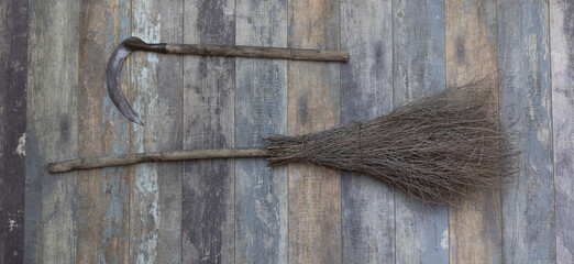 agricultural broom on old wooden background
