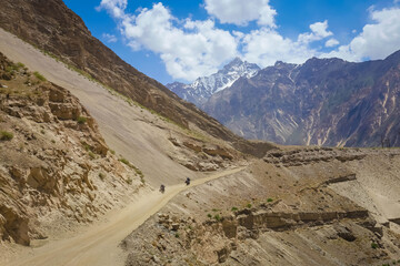 road in the mountains with two bikers