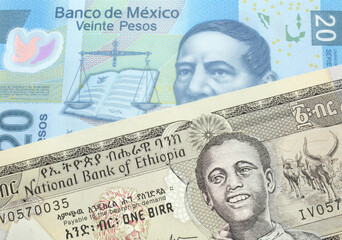 A one birr note from Ethiopia in macro with a twenty Mexican peso bank note close up