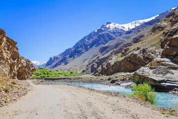 mountain landscape with lake and blue sky