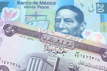 A purple fifty dinar note from Iraq close up with a twenty peso note from Mexico