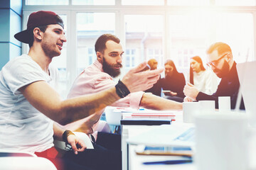 Creative staff of business corporation making decisions to improve marketing project finding new ways for development. Colleagues gather on conference in coworking office to share opinions, solutions