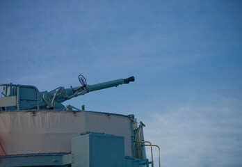  anti-aircraft gun on a warship against the sky