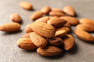 Tasty almond on gray background. Vitamin food