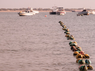 small boats moored in the river near the mouth