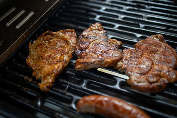 pork neck grilled on a gas grill. Closeup