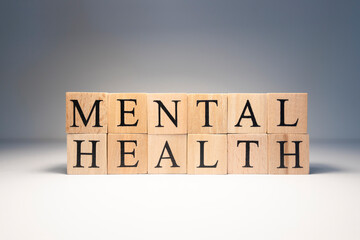 Mental health text from wooden cubes. Consept about health.