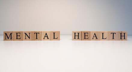 Mental health text from wooden cubes. Consept about health.