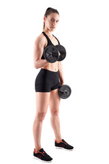 Young athletic woman working out with dumbbells