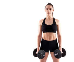 Young athletic woman working out with dumbbells