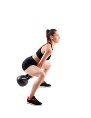 Fototapeta premium Woman working out with kettlebell