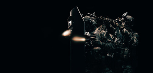 Image of three soldiers in a shooting computer game. ESports concept. They hide behind a tactical...