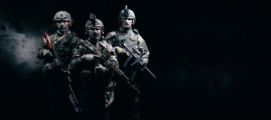 Image of three soldiers in a shooting computer game. ESports concept.