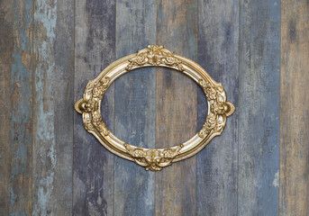 antique museum golden frame on old wooden wall