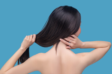 Fototapeta premium Young woman having long dark healthy hair
