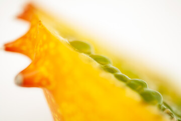 Exotic fruit Kiwano. A blurred image with selective focus on two seeds is shown.