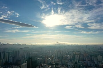Fototapeta premium Foggy morning view in the urban city. Cityscape view. Fog landscape. Sunrise view. Foggy morning view in the urban city life scene, Sao Paulo, Brazil. Cityscape view. Fog landscape. Sunrise view. 