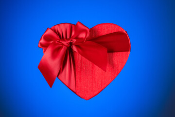 Red heart box on blue background