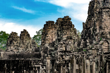 Fototapeta premium SIEM-REAP, CAMBODIA - DECEMBER 10, 2016. Ruined Cambodian Temples of Angkor Complex. Travel Cambodia concept.Ppart of Khmer temple