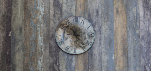 vintage wall clock on old wooden wall