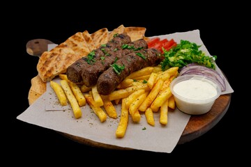 Isolated / Transparent Chargrilled Greek / Arabic Lamb / Pork Skewers Served with Fries / Chips Salad Tzatziki Sauce