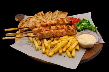 Isolated Transparent Greek / Arabic Chicken Skewers Served With Fries / Chips Salad and Tzatkizi Saunce