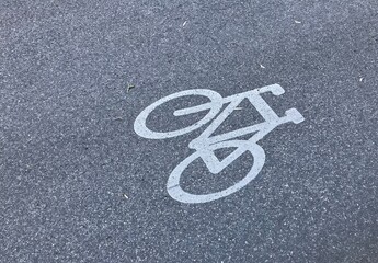 bicycle lane sign on asphalt