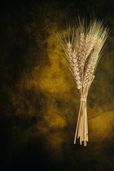 Wheat  spike on vintage yellow background