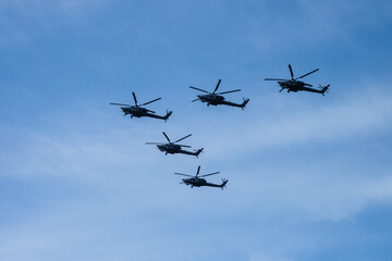 Group military helicopters in the sky