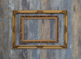 antique museum golden frame collection on old wooden wall