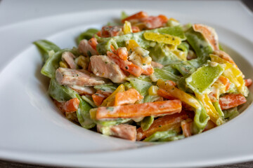 Salmon and Spinach Fettuccine pasta on white dish