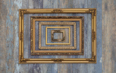 antique museum golden frame collection on old wooden wall