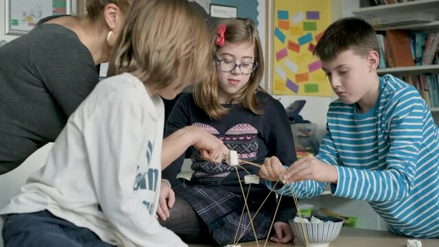 Children setting up construction during a science lesson