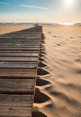 Empty wooden pier walkway on the beach. Selective focus.