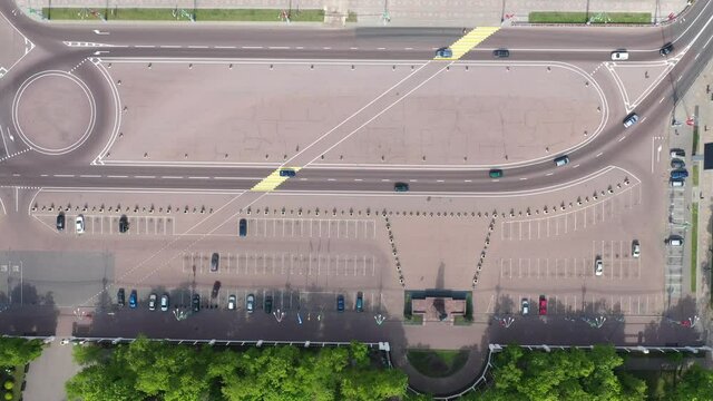 Top Aerial View Of Cityscape. The historic center of Gomel. Lenin Square, cars are moving in a circular motion. Road marking and car parking near the Gomel Park of the Rumyantsev-Paskevichs.
