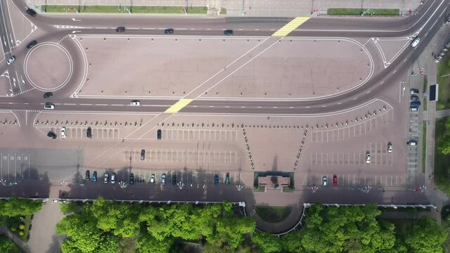 Top Aerial View Of Cityscape. Lenin Square, cars are moving in a circular motion. The historic center of Gomel. Road marking and car parking near the Gomel Park of the Rumyantsev-Paskevichs.
