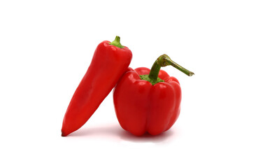 Two red ripe sweet peppers on a light background. Natural product. Natural color. Close-up.