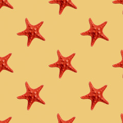 Fototapeta na wymiar Red seastar seamless pattern isolated on yellow background
