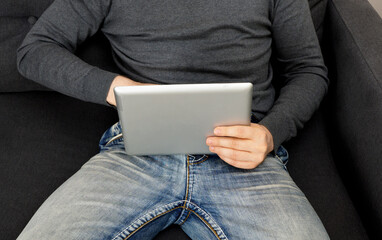 Man watching adult video on tablet pc.