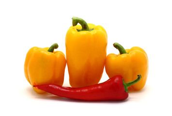 Composition of yellow and red sweet peppers of different sizes on a light background. Natural product. Natural color. Close-up.